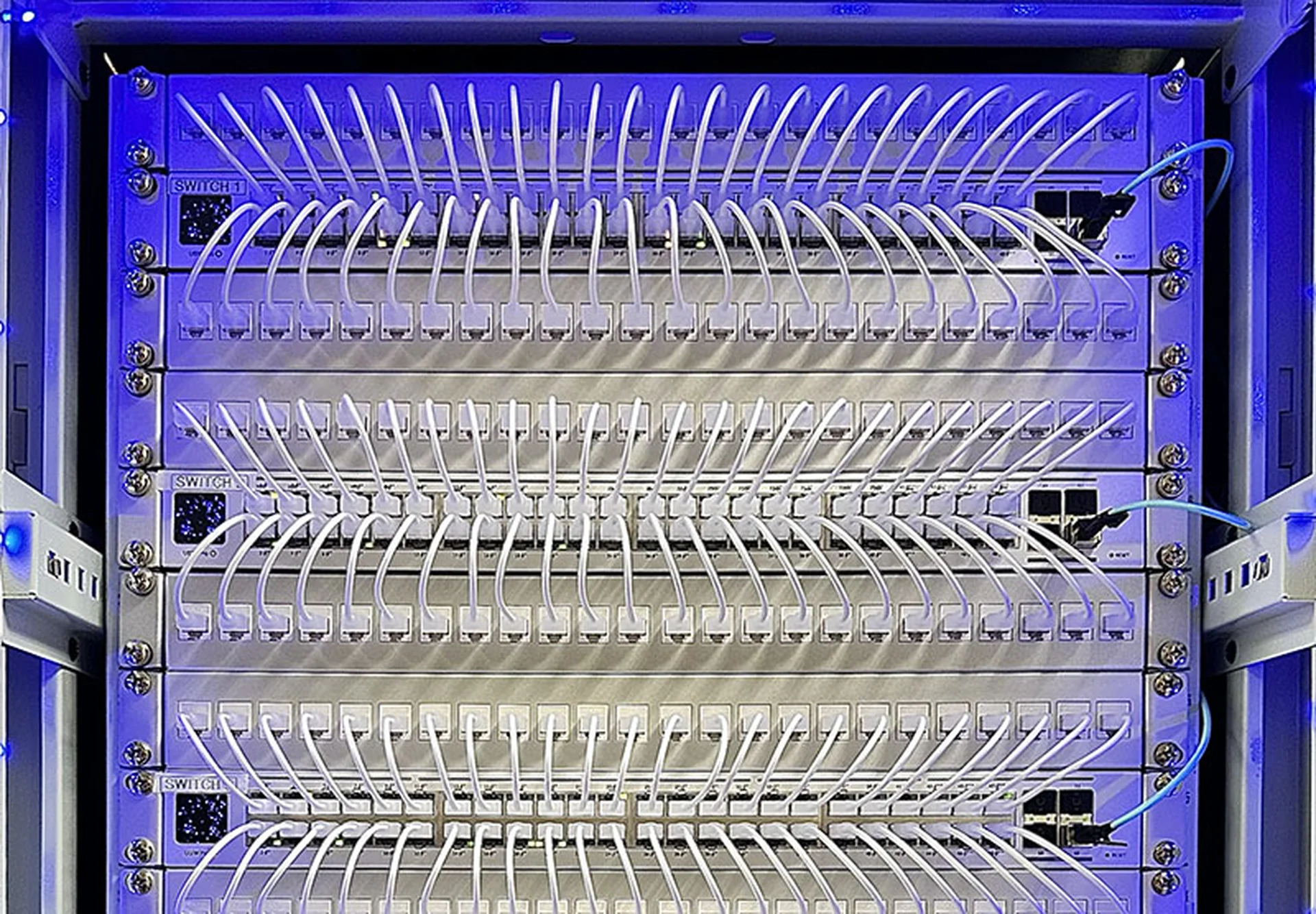 Structured network rack with patch panels and managed Ethernet cabling